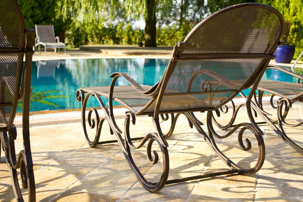 swimming pool lounge chairs tropical